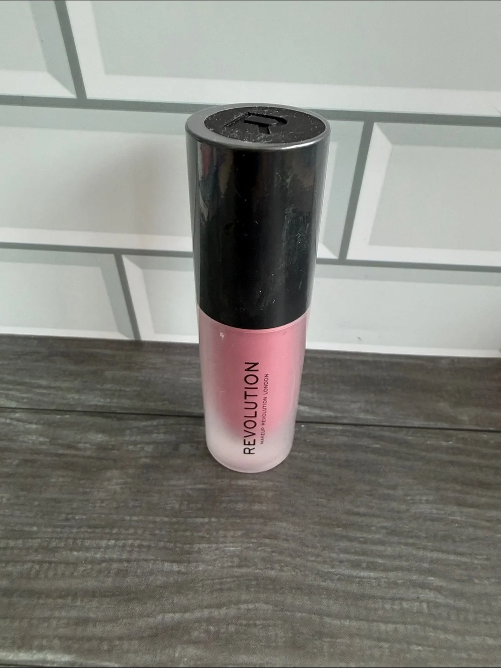 Revolution Pink and Black Lipstick Bottle
